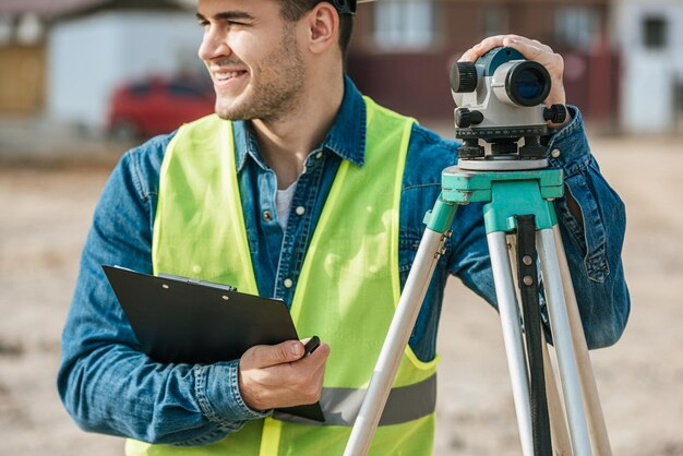 man holding a topograph